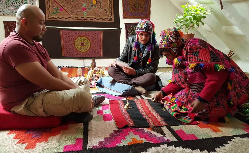 Traditional coca leaf reading in Cusco by an Andean shaman